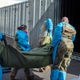 National Guard members assist with processing covid-19 deaths, placing them into temporary storage at the medical examiner-coroner’s office in Los Angeles.